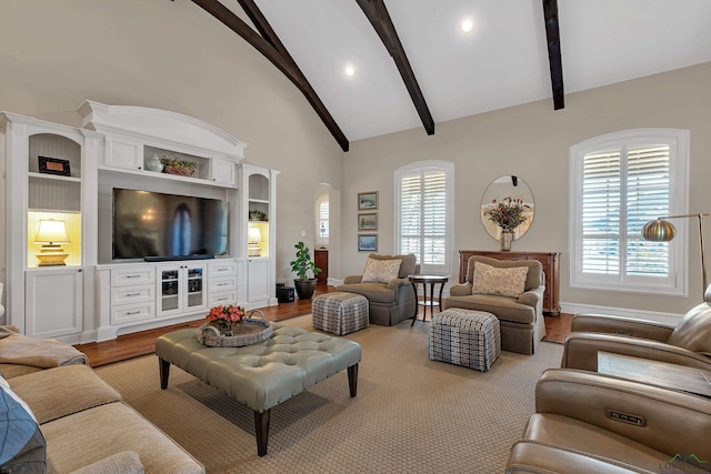 living room featuring beamed ceiling, high vaulted ceiling, and light hardwood / wood-style floors