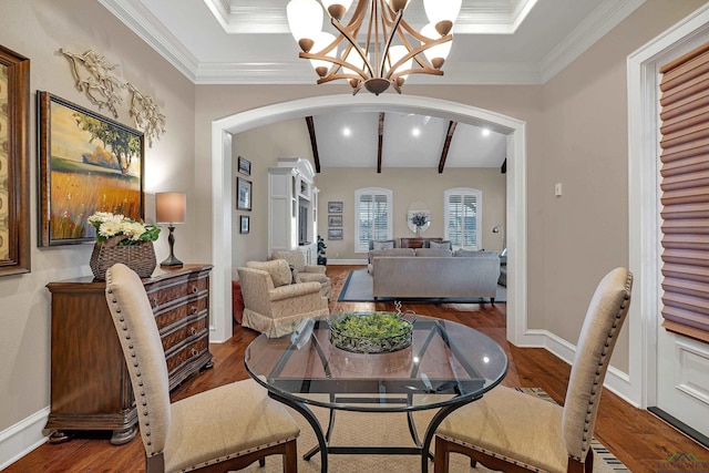 dining area with crown molding, wood-type flooring, and beamed ceiling