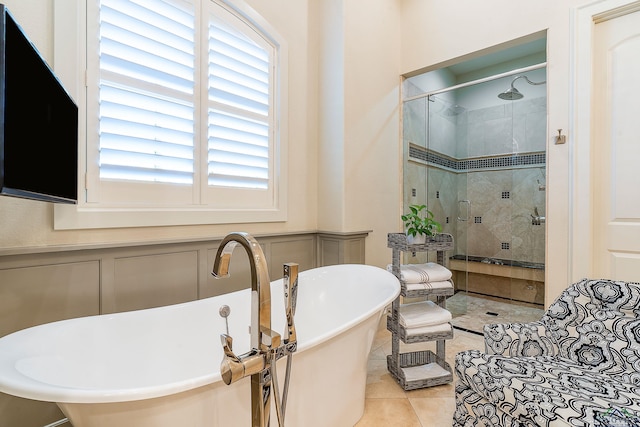 bathroom featuring shower with separate bathtub and tile patterned floors