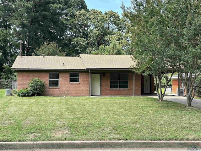 1505 E Birdsong, Longview, TX 75602 - ranch-style home featuring a front yard, driveway, brick siding, and a shingled roof