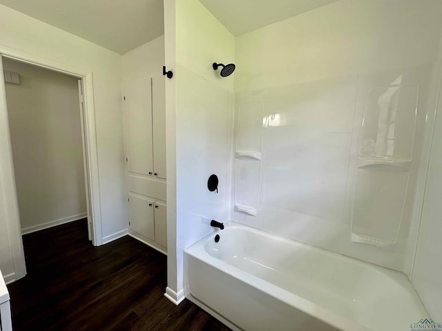1505 E Birdsong, Longview, TX 75602 - bathroom featuring wood finished floors,  shower combination, and baseboards