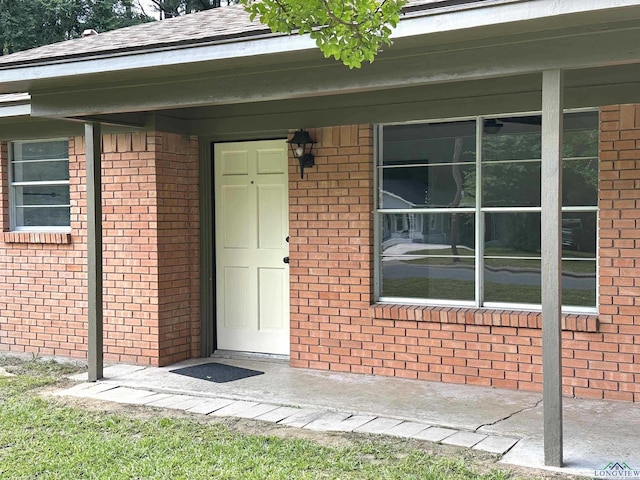 1505 E Birdsong, Longview, TX 75602 - view of exterior entry with brick siding and a porch