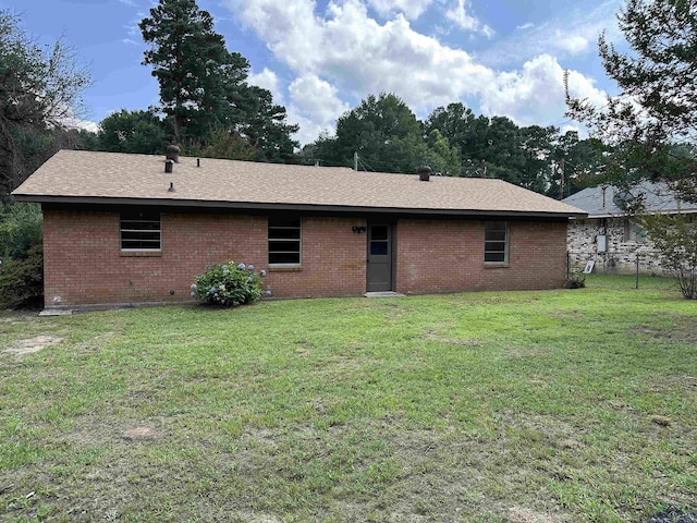 1505 E Birdsong, Longview, TX 75602 - back of house featuring brick siding and a shingled roof