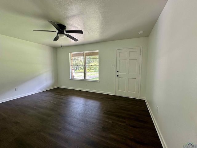 1505 E Birdsong, Longview, TX 75602 - unfurnished room with dark wood-style floors, baseboards, a ceiling fan, and a smoke detector