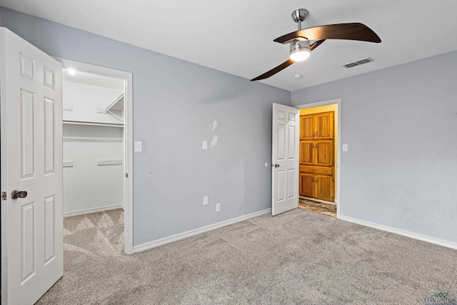 5 Amy Scott Ct, Longview, TX 75605 - unfurnished bedroom featuring carpet, a spacious closet, a closet, and ceiling fan