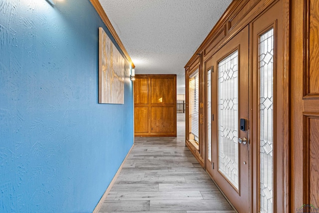 5 Amy Scott Ct, Longview, TX 75605 - corridor featuring a textured ceiling, a textured wall, and light wood-type flooring