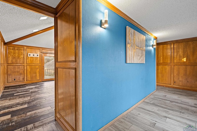 5 Amy Scott Ct, Longview, TX 75605 - hall with a textured ceiling, wood finished floors, crown molding, lofted ceiling, and a textured wall