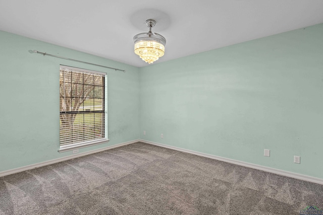 5 Amy Scott Ct, Longview, TX 75605 - empty room with a chandelier and carpet floors