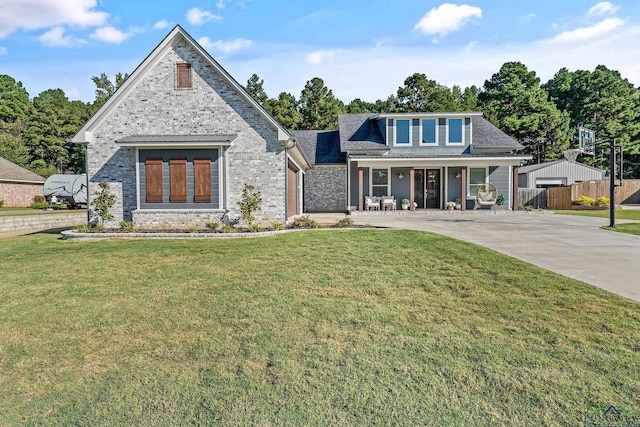 view of front facade with a porch and a front lawn