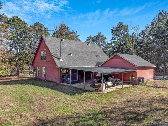 rear view of house with a yard, a patio, and cooling unit