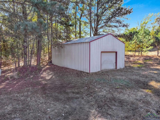 view of outbuilding with a garage