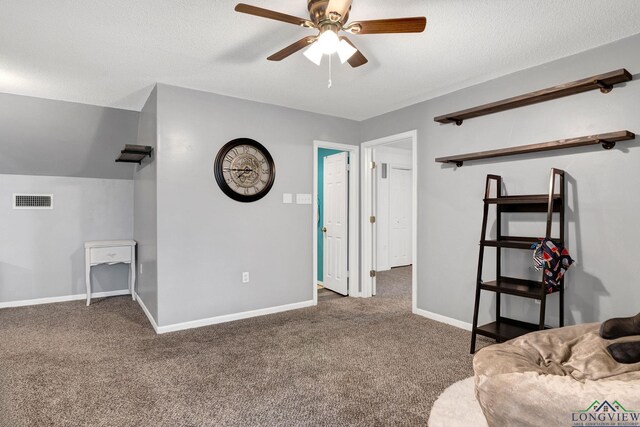 living room featuring ceiling fan and dark carpet