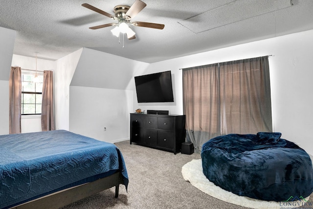 bedroom featuring a textured ceiling, ceiling fan, light carpet, and lofted ceiling