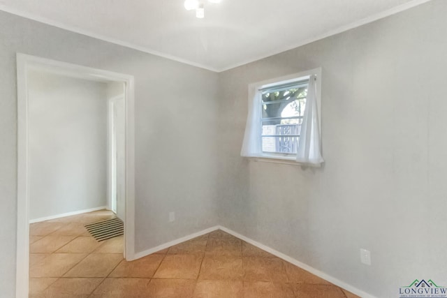 2104 Mccann Rd, Longview, TX 75601 - unfurnished room featuring crown molding and light tile patterned floors