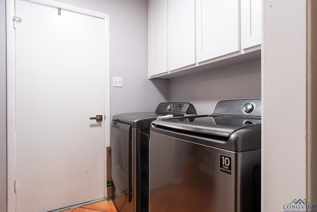 2104 Mccann Rd, Longview, TX 75601 - laundry area with independent washer and dryer and cabinet space