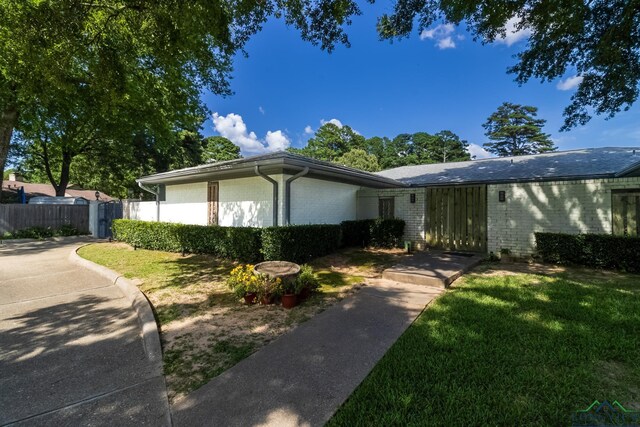 2104 Mccann Rd, Longview, TX 75601 - view of front facade featuring brick siding