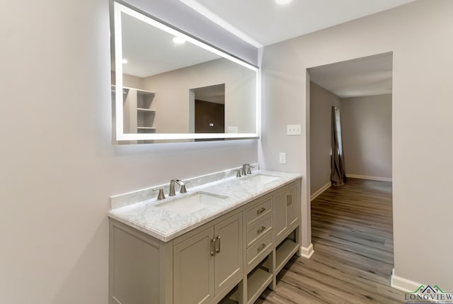 2104 Mccann Rd, Longview, TX 75601 - bathroom with wood finished floors and double vanity