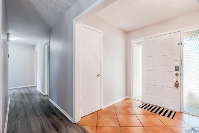 2104 Mccann Rd, Longview, TX 75601 - foyer with baseboards and tile patterned flooring