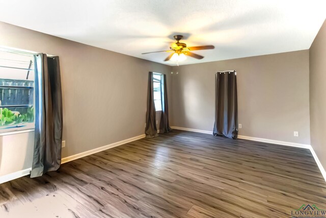 2104 Mccann Rd, Longview, TX 75601 - empty room featuring a ceiling fan and wood finished floors