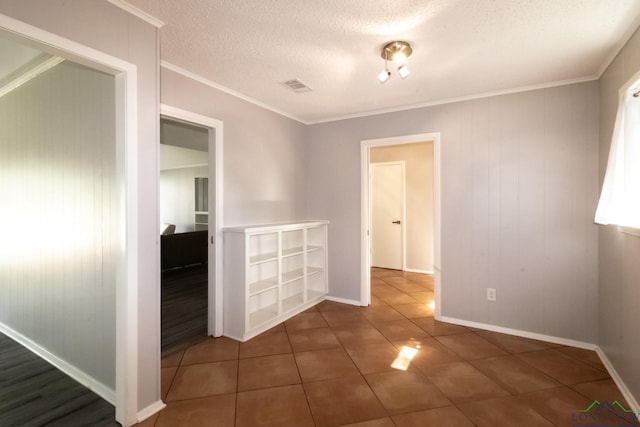 2104 Mccann Rd, Longview, TX 75601 - tiled spare room with ornamental molding and a textured ceiling