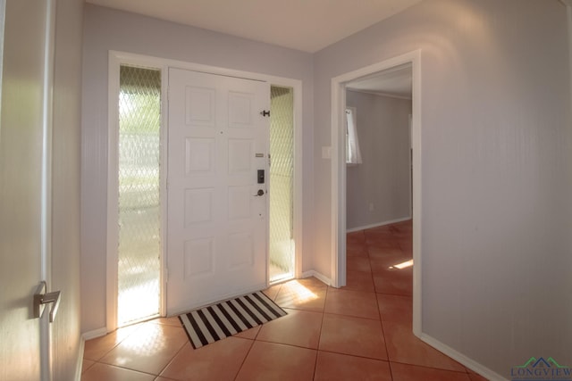 2104 Mccann Rd, Longview, TX 75601 - foyer entrance featuring light tile patterned flooring and healthy amount of natural light