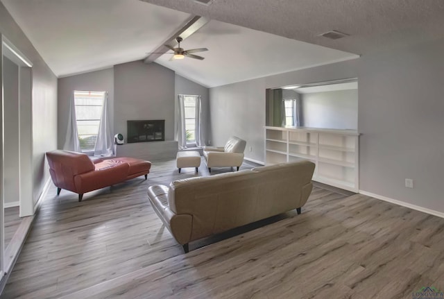 2104 Mccann Rd, Longview, TX 75601 - living room featuring a ceiling fan, wood finished floors, and plenty of natural light