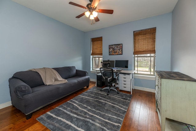 office with dark wood-type flooring and ceiling fan