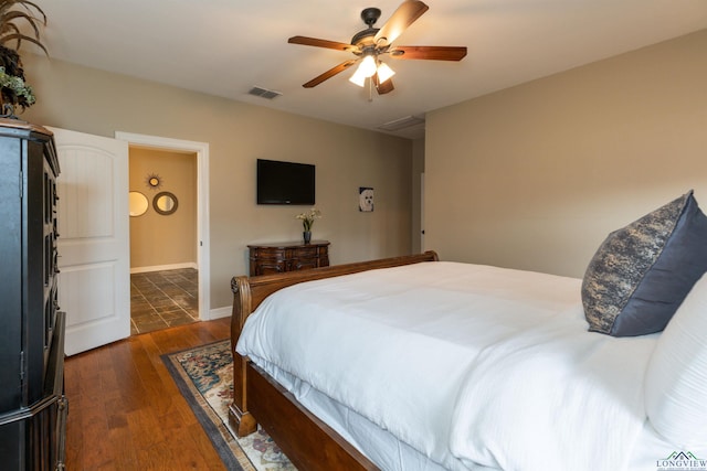 bedroom featuring dark hardwood / wood-style floors and ceiling fan