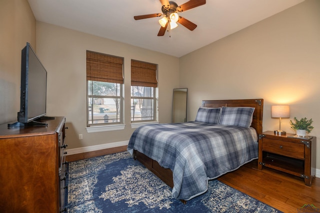 bedroom with dark wood-type flooring and ceiling fan