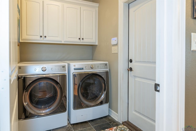 washroom featuring cabinets and washing machine and dryer