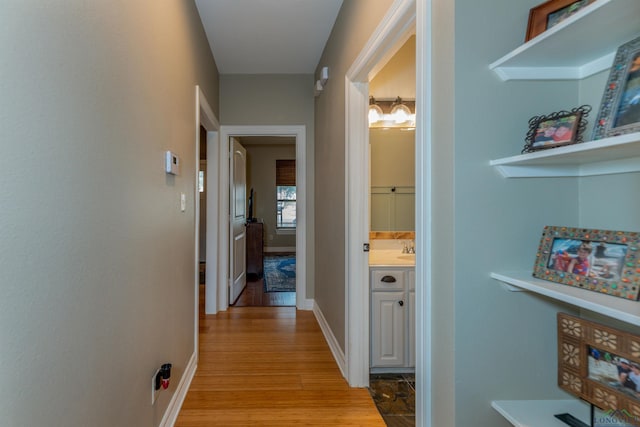 hallway with light wood-type flooring