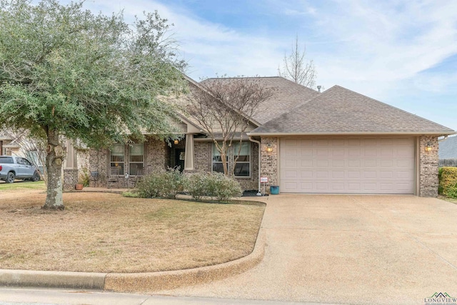 view of front facade with a garage and a front lawn