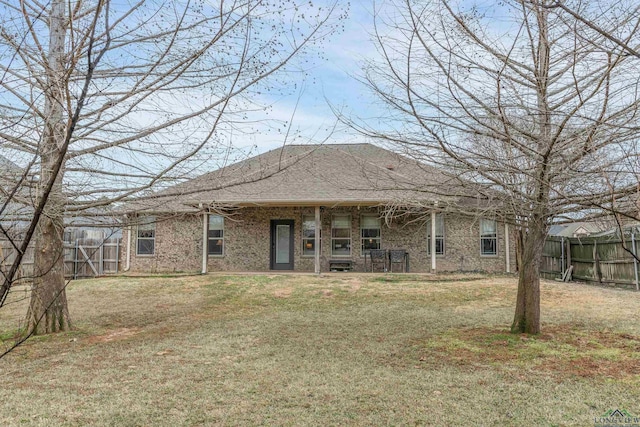 back of house featuring a yard