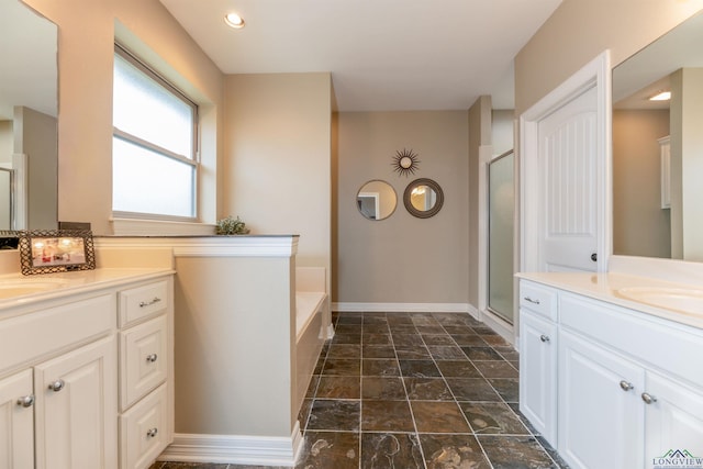 bathroom with vanity and plus walk in shower