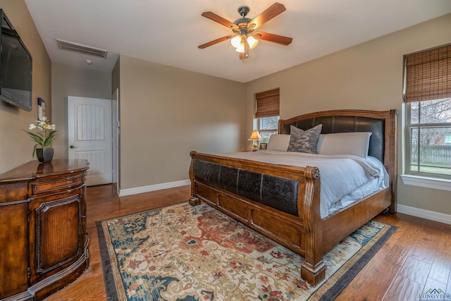 bedroom with wood-type flooring and ceiling fan