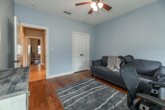 office area featuring ceiling fan and dark hardwood / wood-style flooring