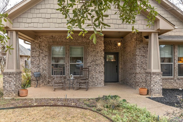 entrance to property with a patio area