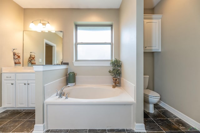 bathroom featuring vanity, a bathtub, and toilet