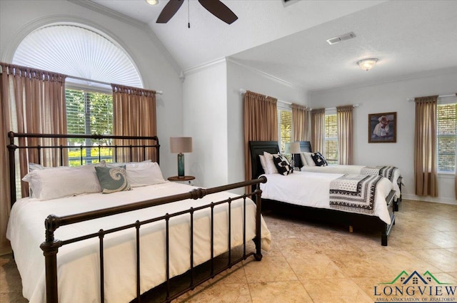 909 University Dr, Carthage, TX 75633 - bedroom with ornamental molding, lofted ceiling, baseboards, and ceiling fan
