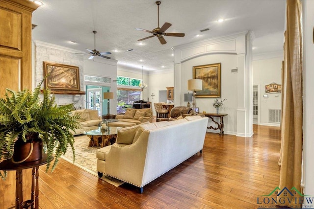 909 University Dr, Carthage, TX 75633 - living area with a ceiling fan, crown molding, wood-type flooring, baseboards, and recessed lighting