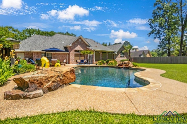 909 University Dr, Carthage, TX 75633 - view of pool with a patio