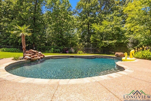 909 University Dr, Carthage, TX 75633 - view of pool featuring view of scattered trees