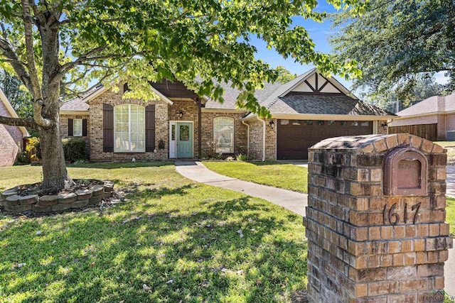 view of front of home featuring a front lawn and a garage