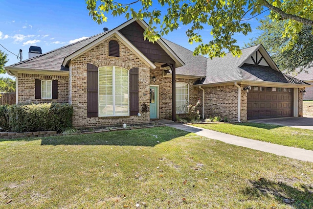 view of front of house featuring a garage and a front lawn