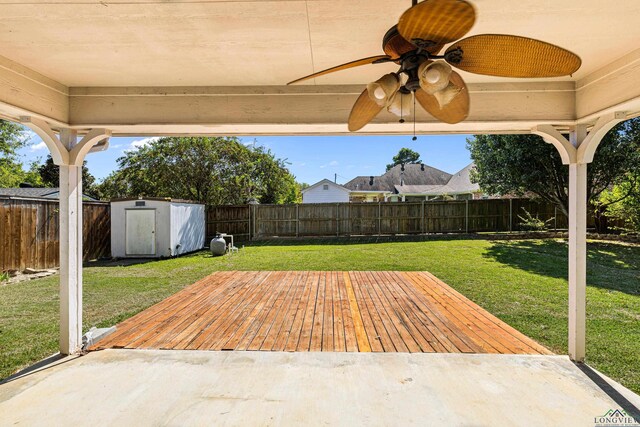 view of patio with a storage shed