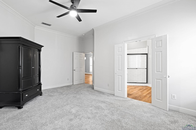 unfurnished bedroom with ceiling fan, ornamental molding, and light colored carpet