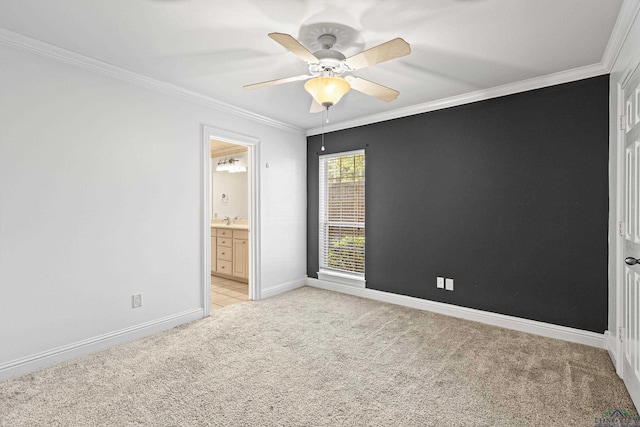 unfurnished bedroom featuring connected bathroom, sink, ceiling fan, light colored carpet, and crown molding