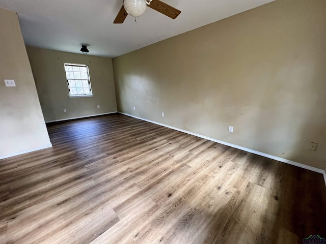 unfurnished room with light hardwood / wood-style flooring and ceiling fan