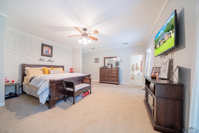 carpeted bedroom featuring ensuite bath, ceiling fan, and ornamental molding