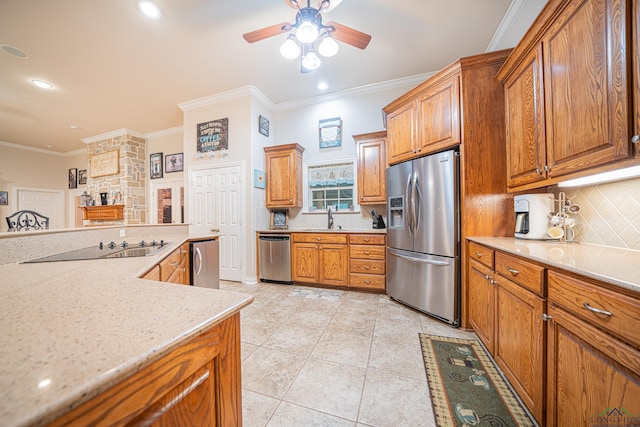 kitchen with decorative backsplash, appliances with stainless steel finishes, ornamental molding, sink, and light tile patterned flooring